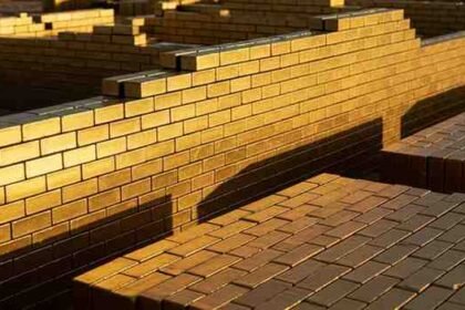 gold brick nyt crossword clue