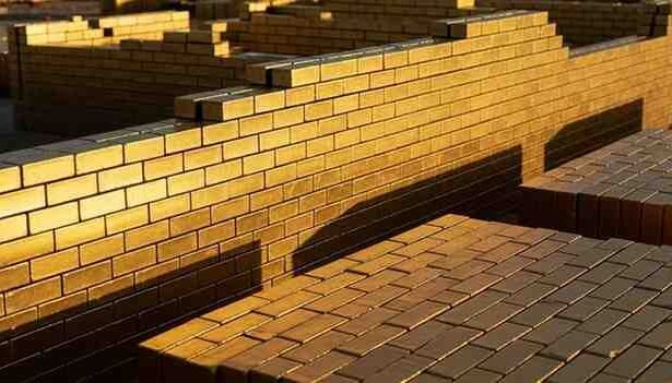 gold brick nyt crossword clue