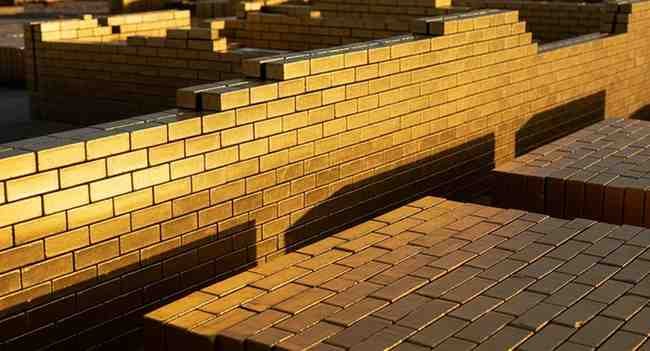 gold brick nyt crossword clue